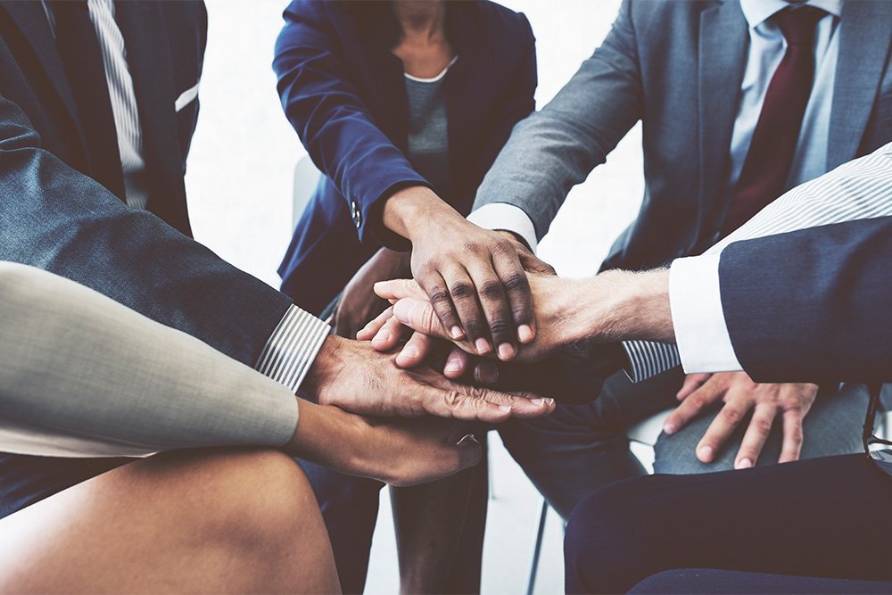 Business team with stacked hands